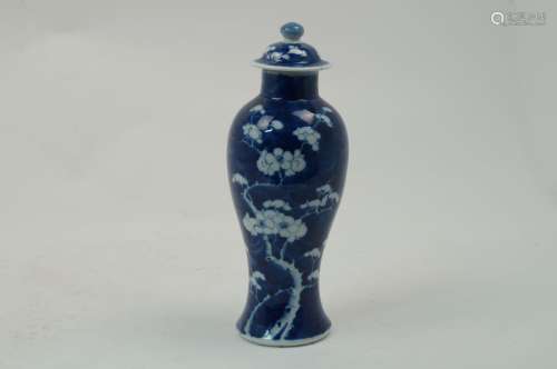 A Chinese prunus pattern vase, late 19th/early 20th century, of baluster form, removable cover