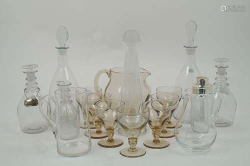 A selection of mid-20th century and later glass decanters and jugs, to include, a brown glass