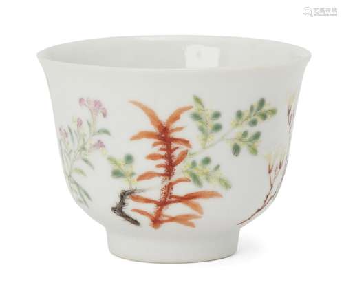 A Chinese porcelain tea bowl, 19th century, finely painted in famille rose enamels with floral