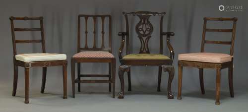 A George III style mahogany armchair, the serpentine top rail, with carved flower heads and acanthus