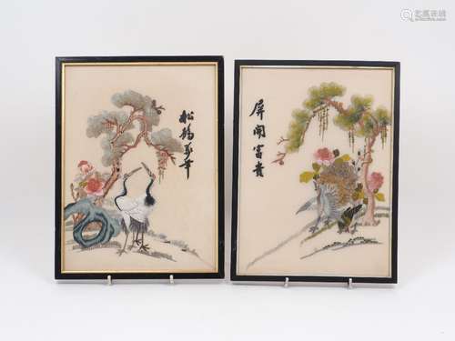 A pair of Chinese needlework pictures, each of rectangular form, each polychrome design depicting