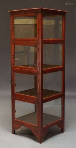 A Chinese red stained vitrine cabinet, late 20th Century, glazed to each side, the front with four