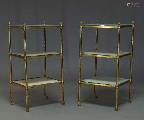 A pair of brass three tier etageres, second half 20th Century, with acorn finials and three