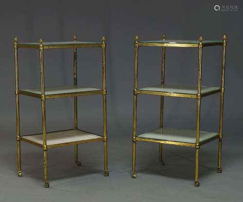 A pair of brass three tier etageres, second half 20th Century, with acorn finials and three