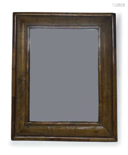 A William and Mary style walnut wall mirror, 19th Century, of rectangular form with cushion