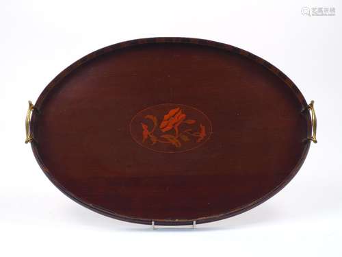 A mahogany tray, early 20th century, of oval form, designed with a central floral spray fruitwood