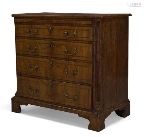 A George II walnut bachelor's chest, the quarter veneered top, above brush slide and four long