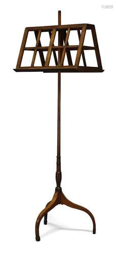 A George III mahogany duet stand, with adjustable slatted rests on turned pole to tripod legs with