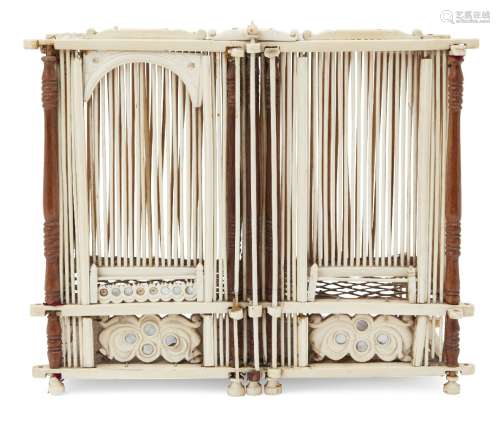 A Chinese bone and boxwood rectangular cricket cage, early 20th century, with turned corner supports