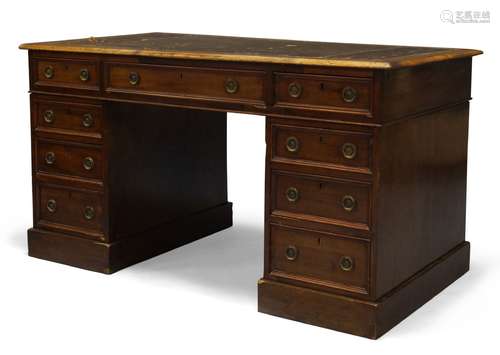 A mahogany pedestal desk, early 19th Century, the rounded rectangular top inset with green leather