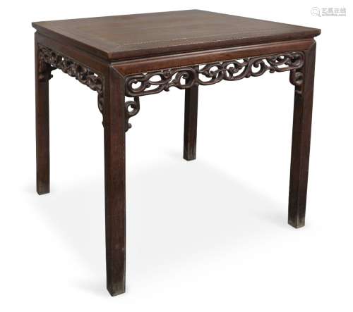 A Chinese hongmu square table, late 19th century, with carved foliate scroll frieze raised on square