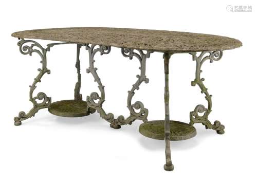 A white painted cast aluminium garden table, late 20th Century, with pierced decorative top on