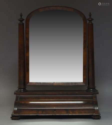 A large Victorian mahogany toilet mirror, the arched plate on cylindrical tapered column supports,