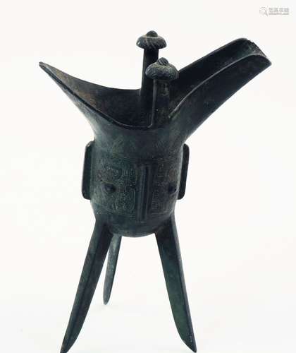 A Chinese bronze archaistic wine vessel, jue, Shang dynasty-style, the deep U-shaped body raised