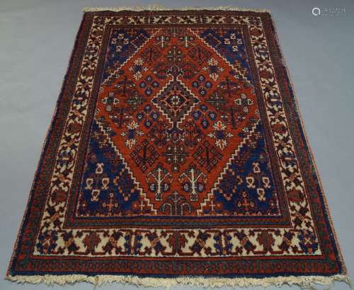 A shiraz rug, with floral motifs in a red field, with ivory main border, 200cm x 132cm, together