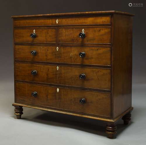 A Victorian mahogany chest of drawers, with blind frieze drawer over two short and three long