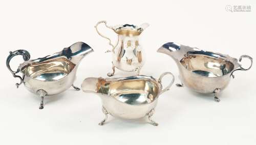 A pair of silver sauce boats, Birmingham, c.1923, S. Blanckensee & Son Ltd., both with scalloped