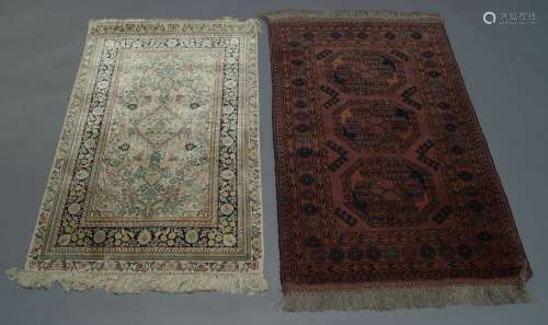 A West Persian silk rug, late 20th Century, with central medallion and overall foliate design with