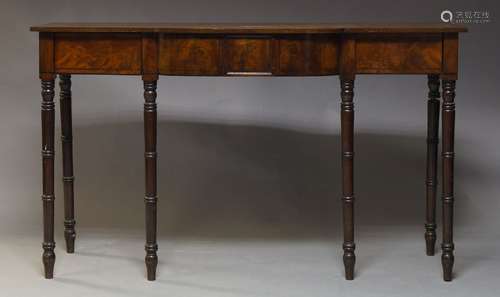 A Regency mahogany and line inlaid sideboard, with two frieze drawers, raised on ringed turned legs,