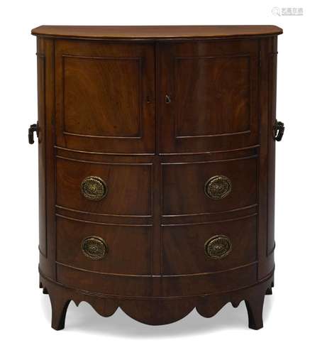 A George III mahogany demi-lune commode, with pair of curved and panelled cupboard doors above a