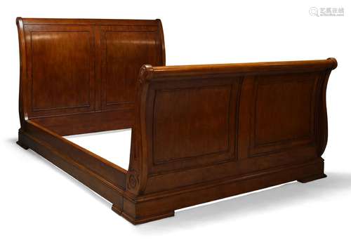 A large mahogany lit en bateau, late 20th Century, with scrolling panelled ends, 122cm high,167cm