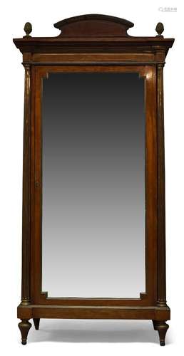 A French mahogany and gilt metal mounted mahogany wardrobe, 19th Century, the rectangular cavetto-