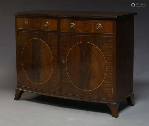 A mahogany and crossbanded cabinet in the Georgian taste, late 20th Century, with two frieze drawers