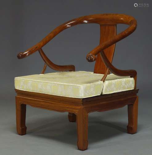 A Chinese hardwood horse shoe armchair, late 20th Century, with curved back and loose seat
