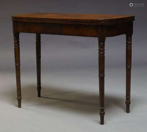 A Regency mahogany and crossbanded card table, the fold over top enclosing green baize lined playing