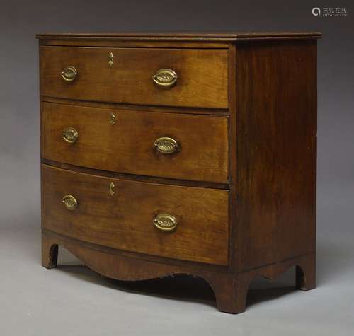 A Regency mahogany chest, with three long graduated drawers, raised on splayed bracket feet, 85cm