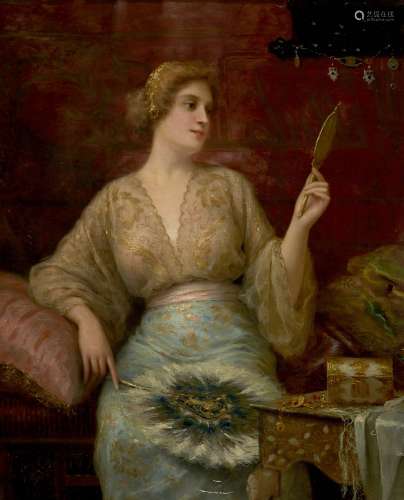 Antonio Torres, Spanish b. 1851-1934- A lady in her boudoir looking into a hand mirror; oil on