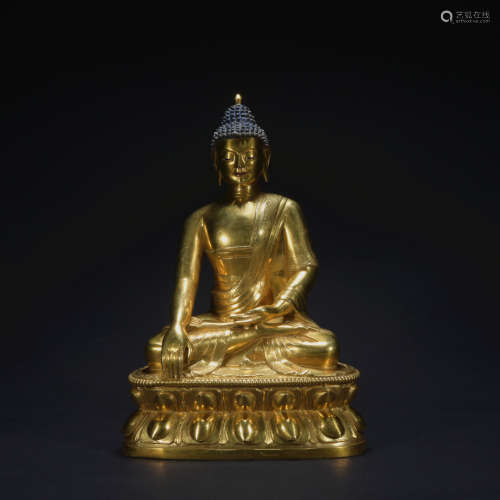 A gilt-bronze statue of Shakya Mani
