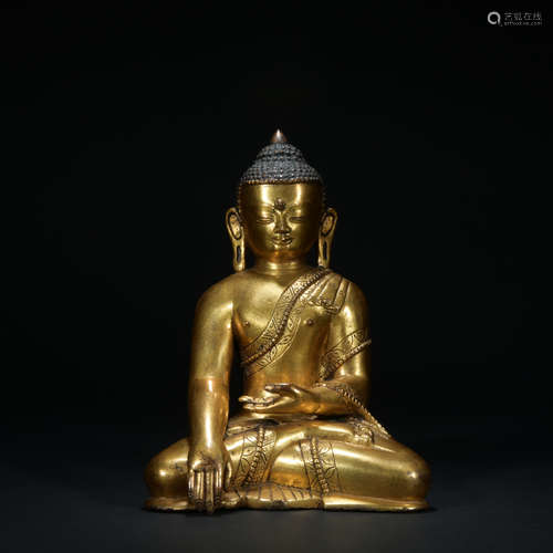 A gilt-bronze statue of shakyamuni