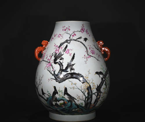 A pastel dragon ear goblet with the magpie ascends the plum design