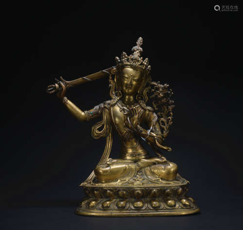 A gilt-bronze statue of the Manjushri