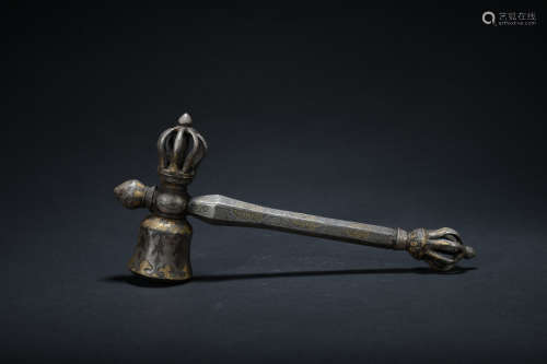 A bronze hammer inlaid with gold and silver