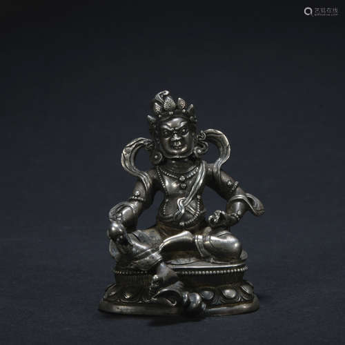 A silver statue of Mammon