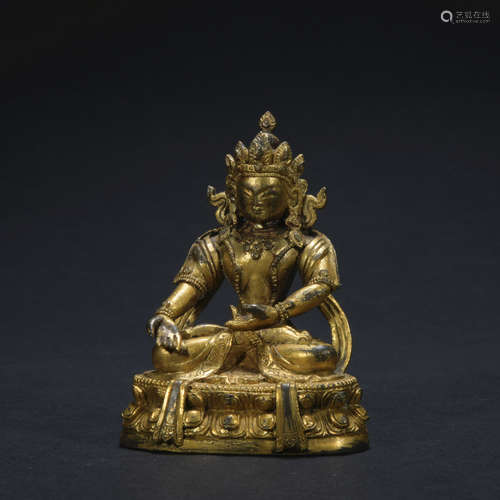 A gilt-bronze statue of Shakya Mani