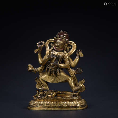 A gilt-bronze statue of Four-armed Guan Yin
