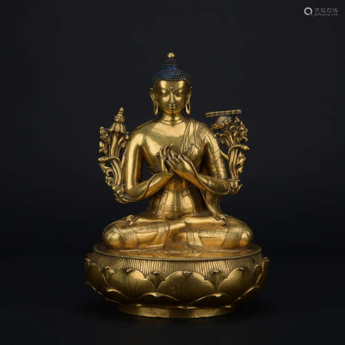 A gilt-bronze statue of Maitreya