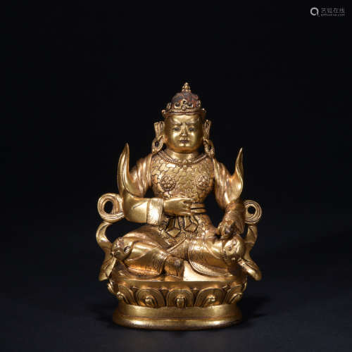 A gilt-bronze statue of Dharmapalas