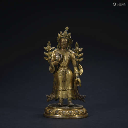 A gilt-bronze standing statue of Guanyin