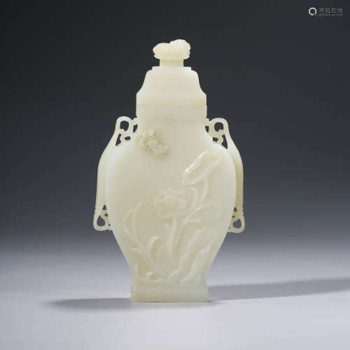 A CHINESE WHITE JADE LOTUS VASE AND COVER