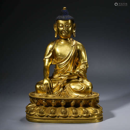 A CHINESE GILT-BRONZE SAKYAMUNI STATUE