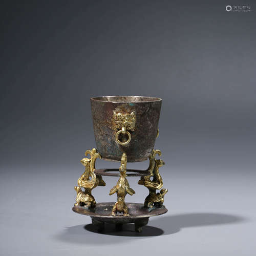 A CHINESE SILVER GILDING CUP AND HOLDER