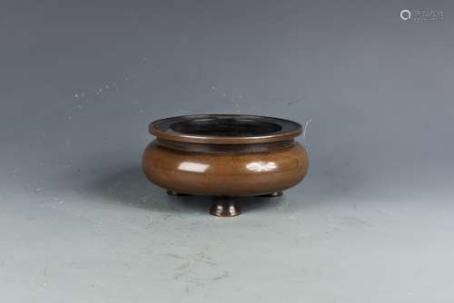 A BRONZE TRIPOD CENSER