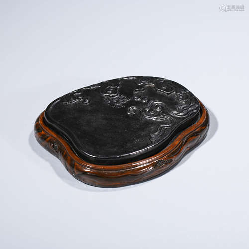 A CHINESE INK-GLAZED PORCELAIN INKCAKE AND STAND MARKED QIAN LONG