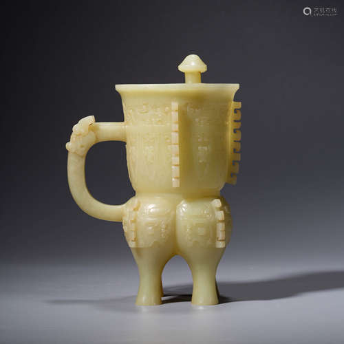 A CHINESE YELLOW JADE TAOTIE MASK WINE VESSEL JUE