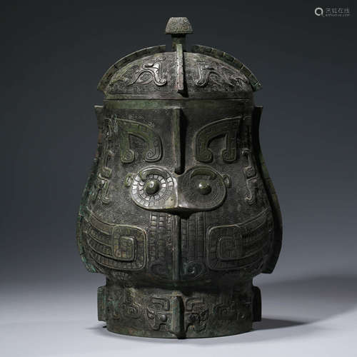 A CHINESE ARCHIASTIC BRONZE TAOTIE MASK WINE VESSEL, YOU