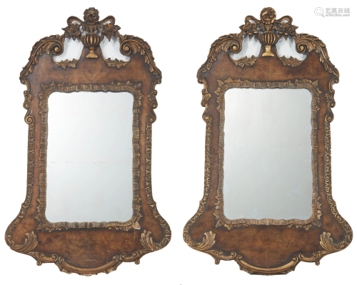 A pair of English carved and giltwood wall mirrors